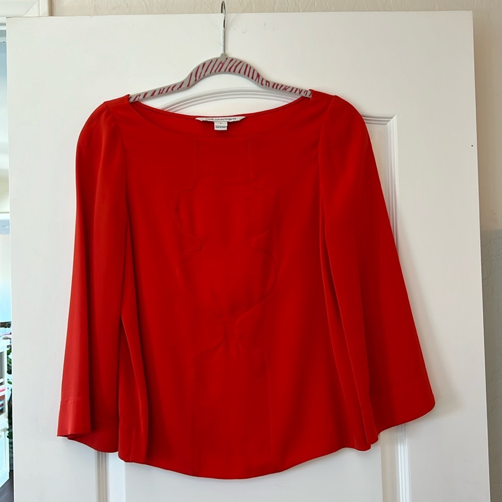 Diane von furstenburg top with detail. Beautiful red/orange color gently used